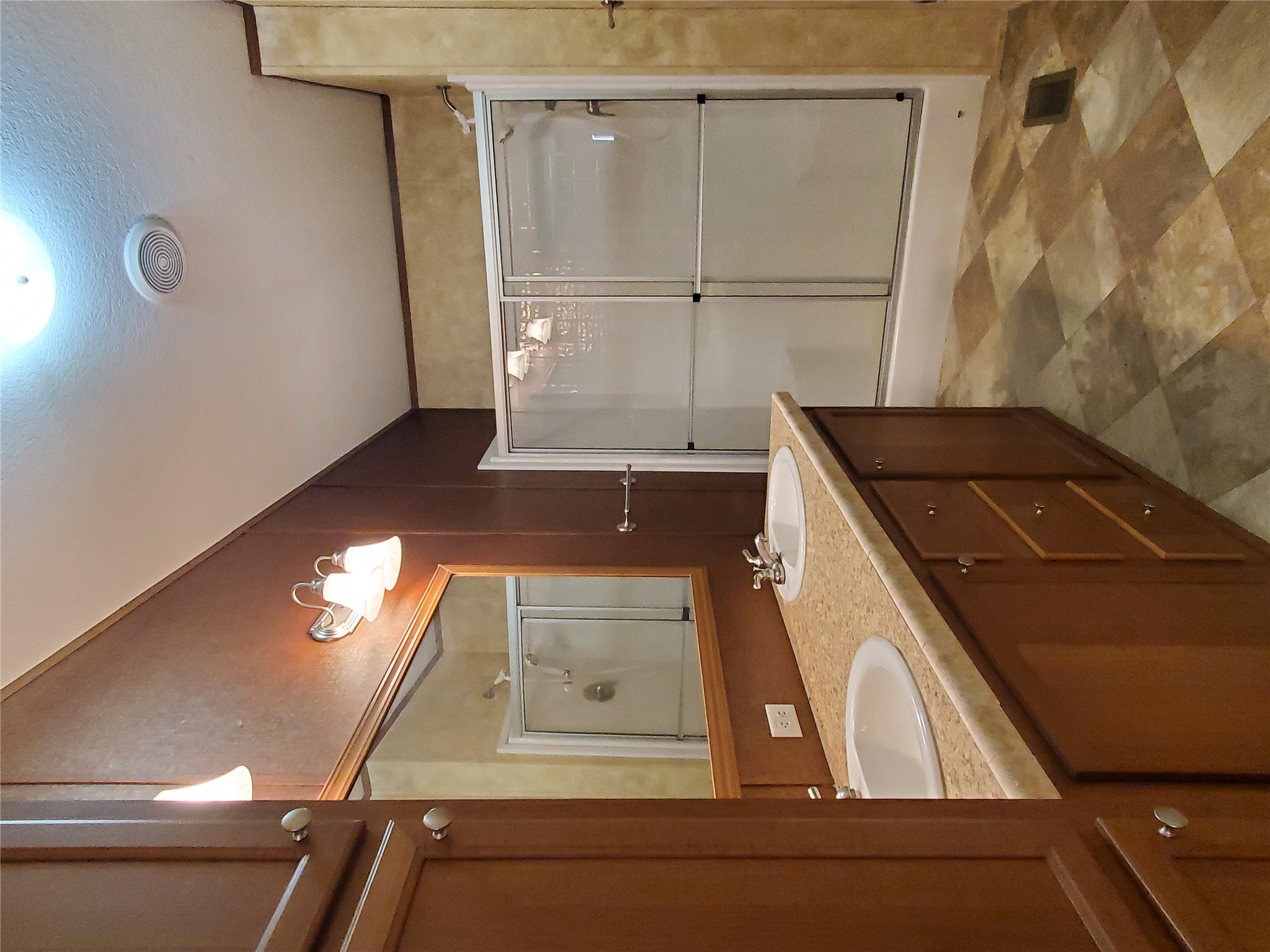 61 County Road 433 Taylor, TX 76574 - Photo 14 of 18 a bathroom with a sink mirror and a shower