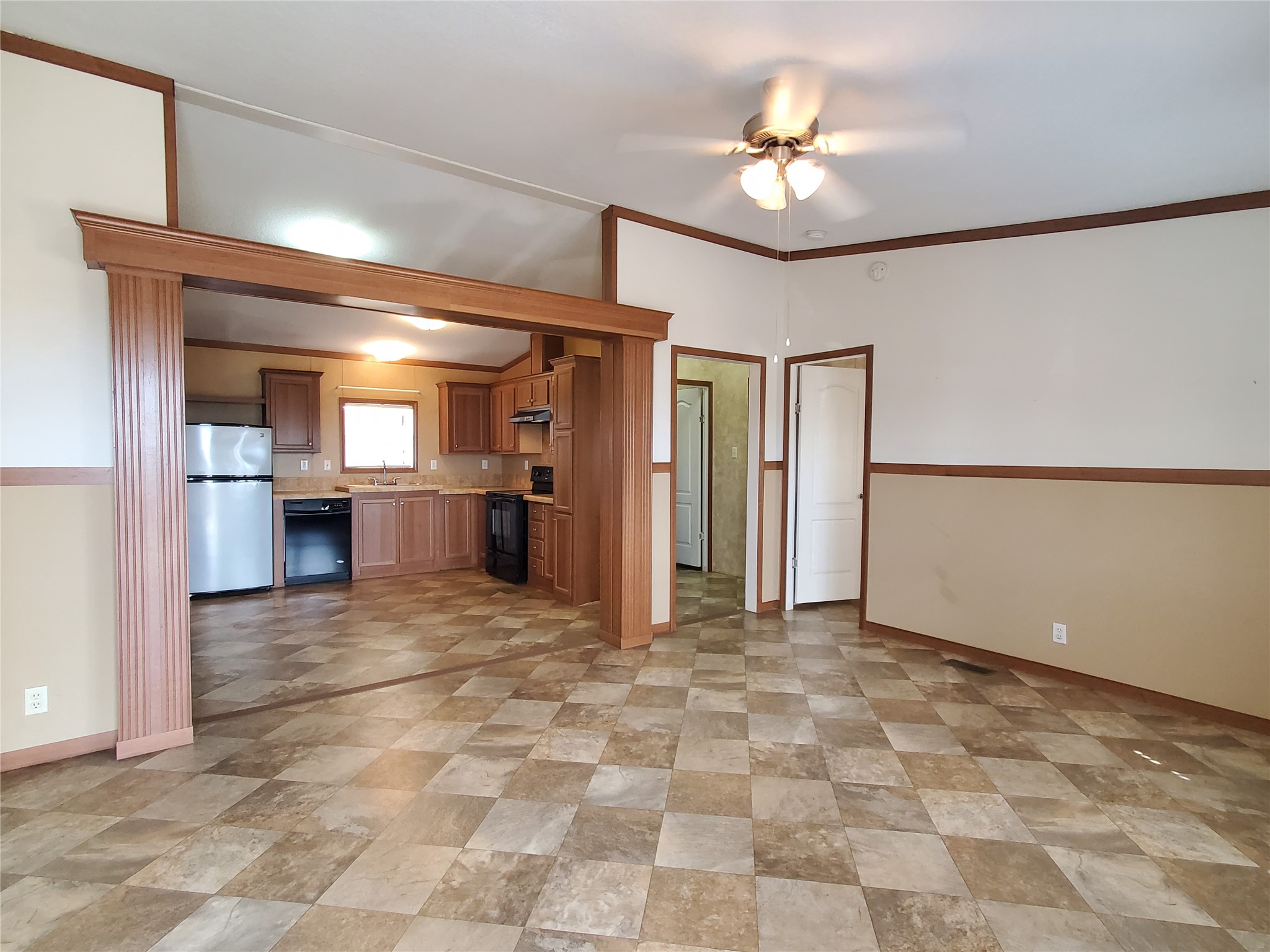61 County Road 433 Taylor, TX 76574 - Photo 5 of 18 a view of a kitchen with a sink and a refrigerator