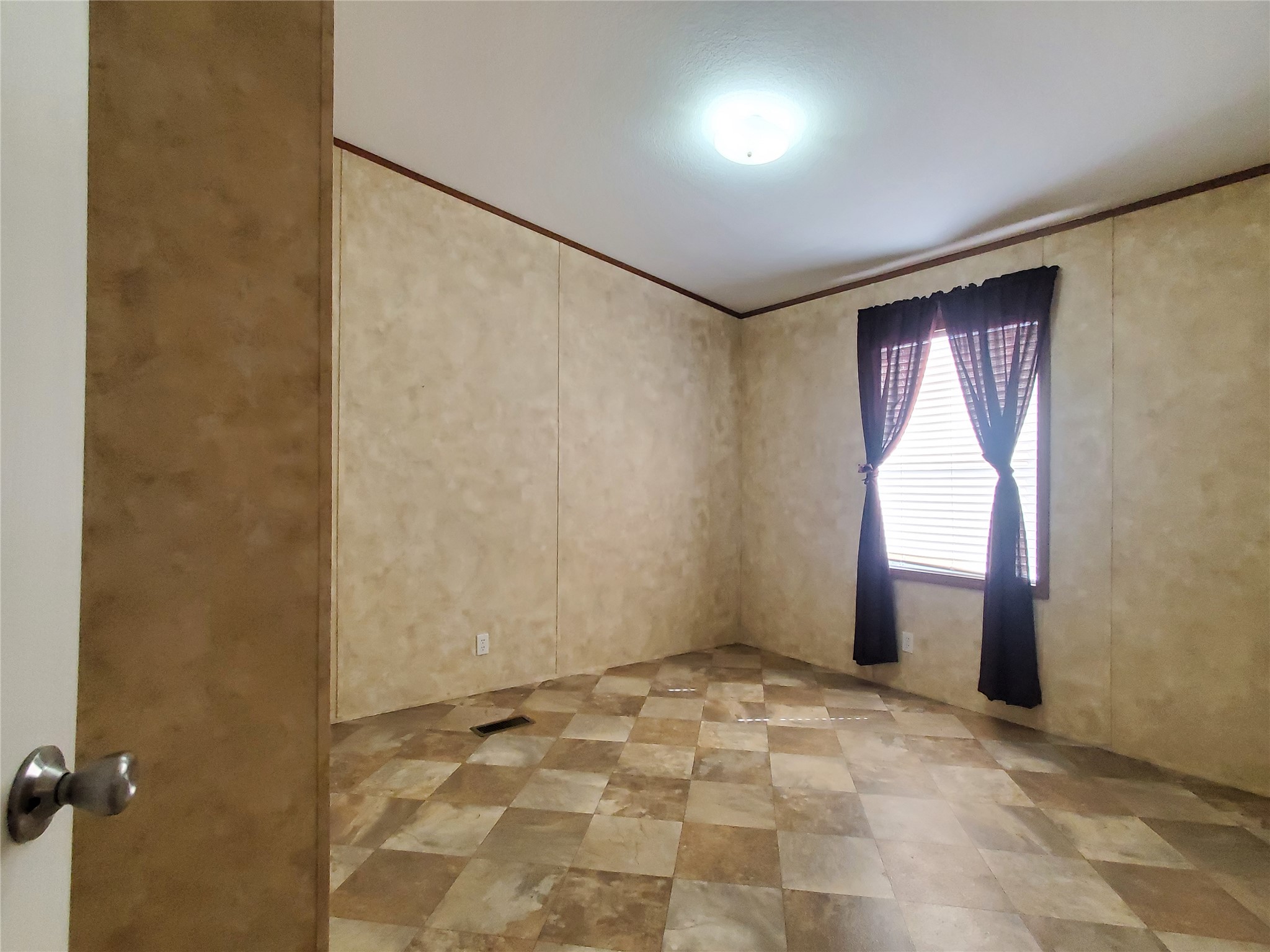 61 County Road 433 Taylor, TX 76574 - Photo 9 of 18 a view of an empty room and window