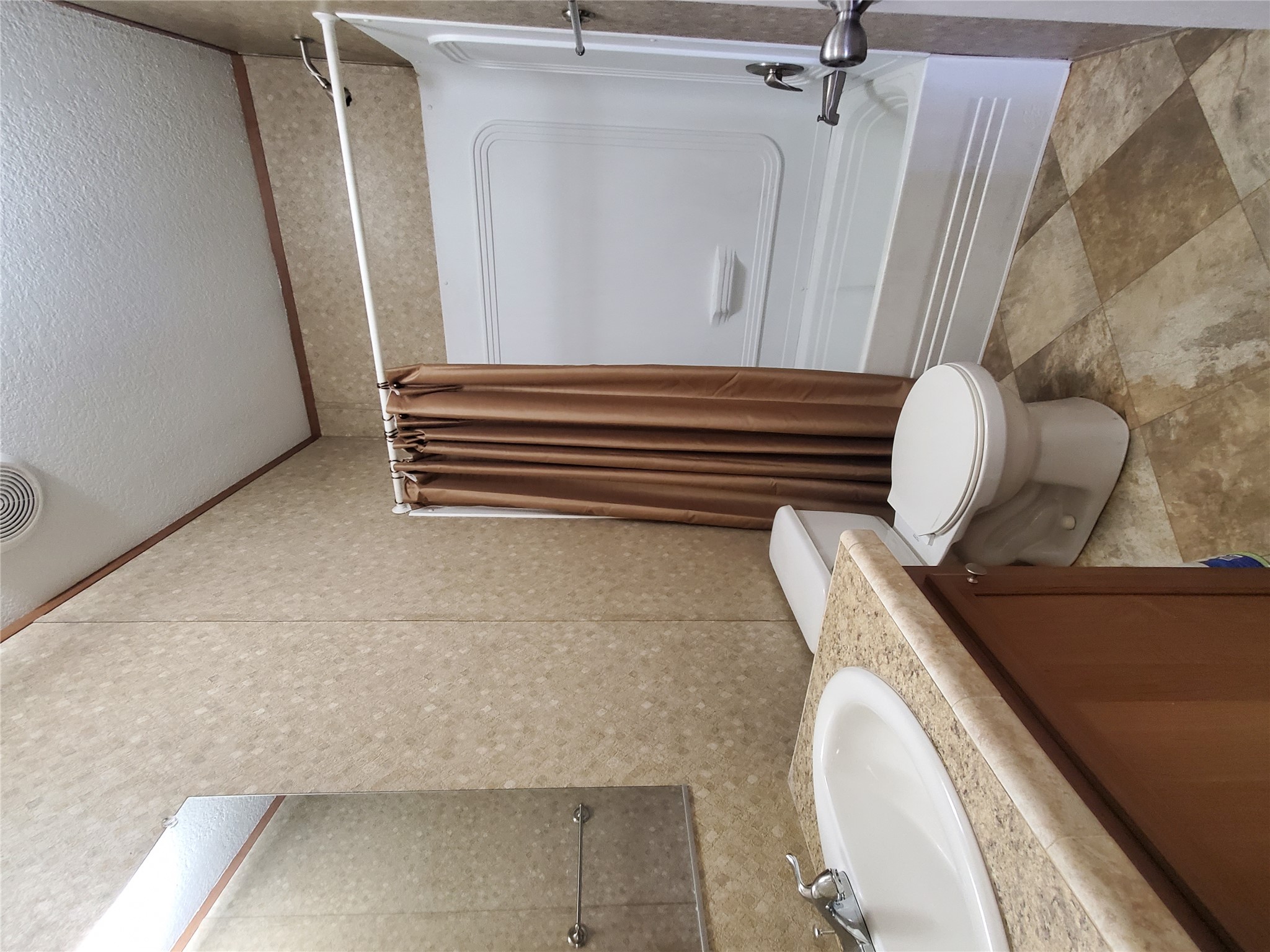 61 County Road 433 Taylor, TX 76574 - Photo 10 of 18 a bathroom with a granite countertop sink toilet and shower