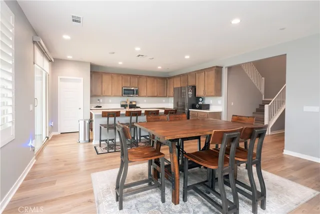 a kitchen with stainless steel appliances granite countertop a refrigerator sink and cabinets