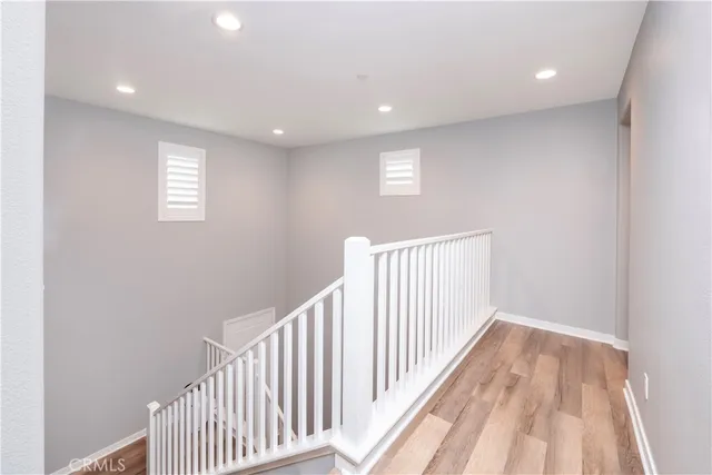 a bathroom with a sink mirror and vanity