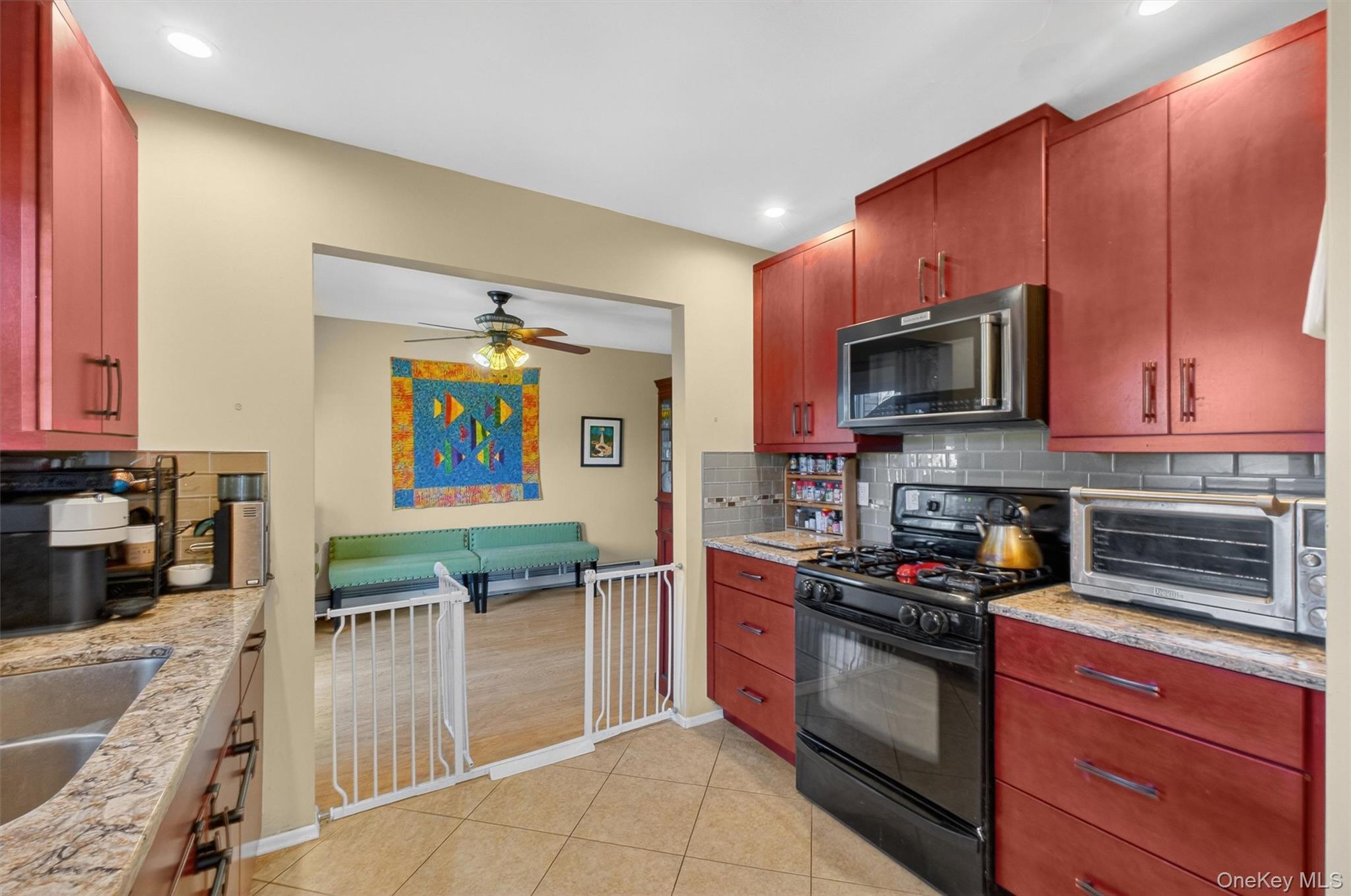 42 Larch Court Fishkill, NY 12524 - Photo 11 of 29 a kitchen with stainless steel appliances a stove a sink and a microwave