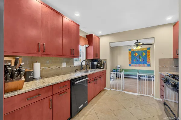 a kitchen with stainless steel appliances granite countertop a sink and cabinets