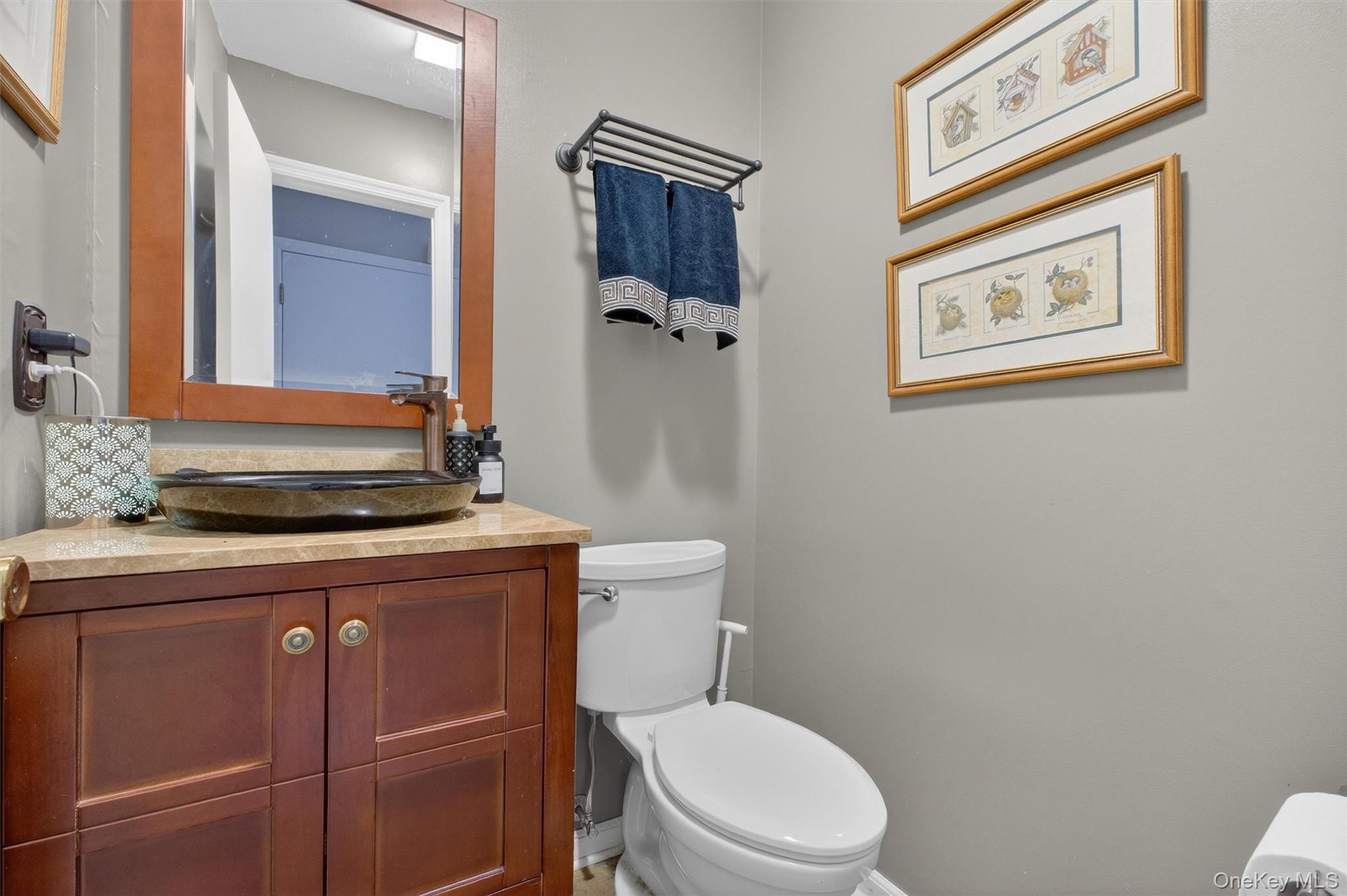 42 Larch Court Fishkill, NY 12524 - Photo 15 of 29 a bathroom with a toilet a sink and a mirror