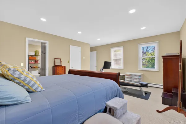 a bedroom with furniture and a window