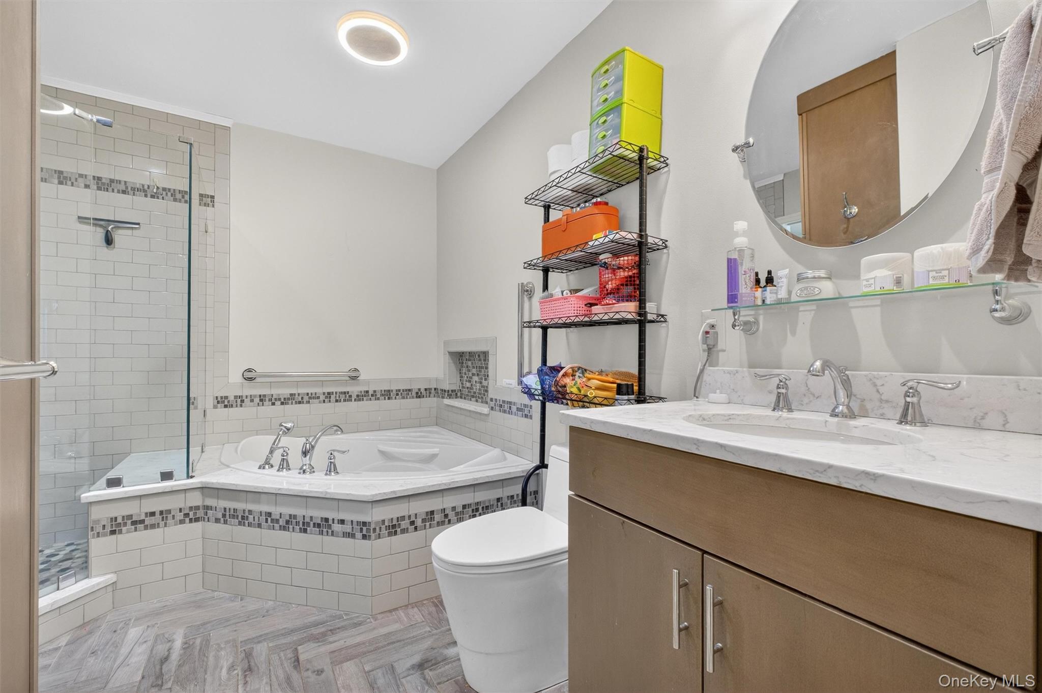 42 Larch Court Fishkill, NY 12524 - Photo 18 of 29 a bathroom with a granite countertop sink mirror vanity and toilet