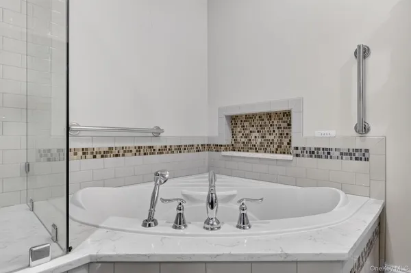 a bath tub sitting next to a bathroom