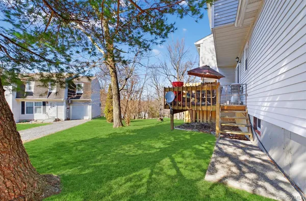 a view of a chairs in a backyard