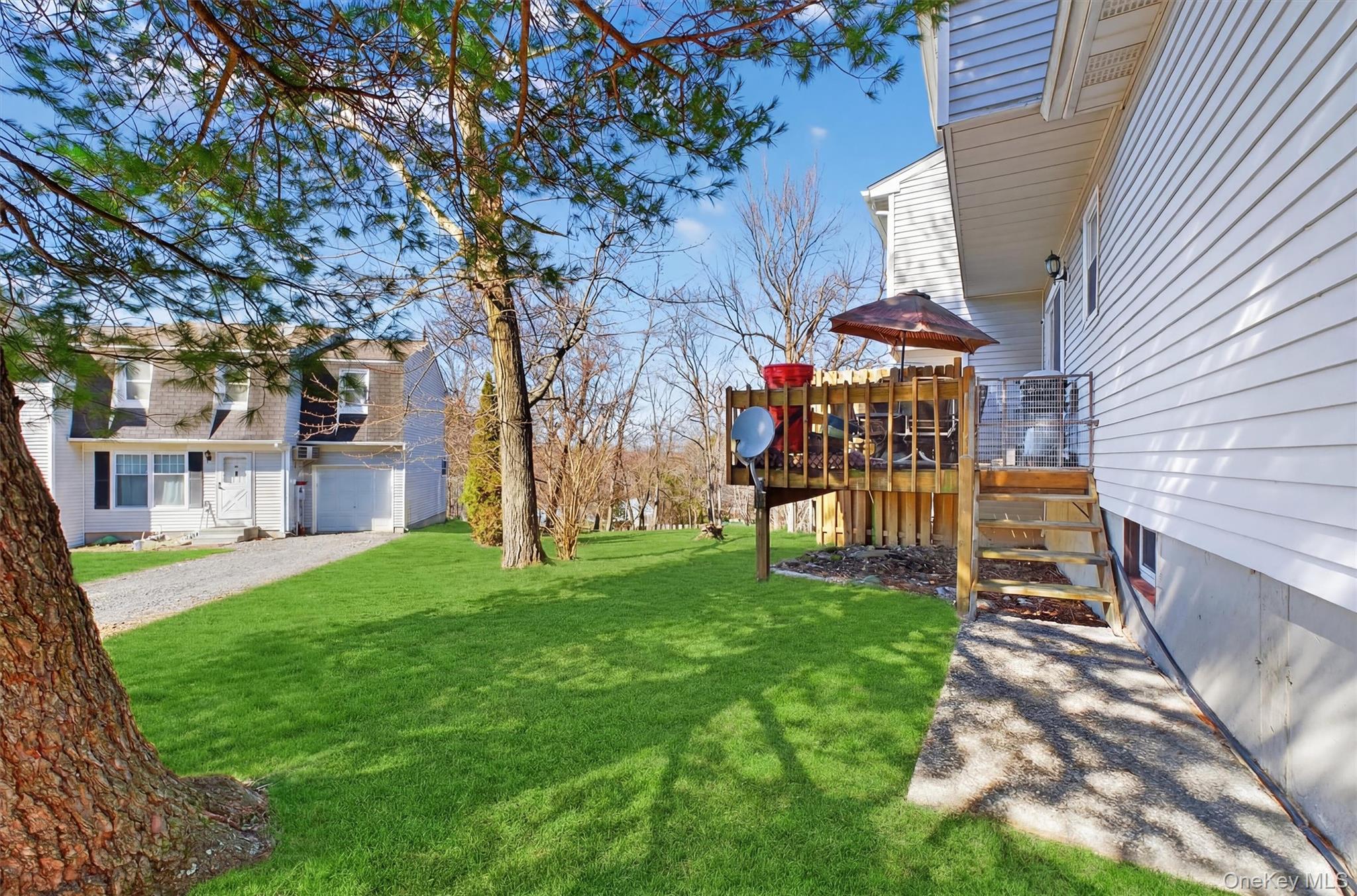 42 Larch Court Fishkill, NY 12524 - Photo 24 of 29 a view of a chairs in a backyard