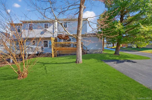 a view of a big yard next to a house