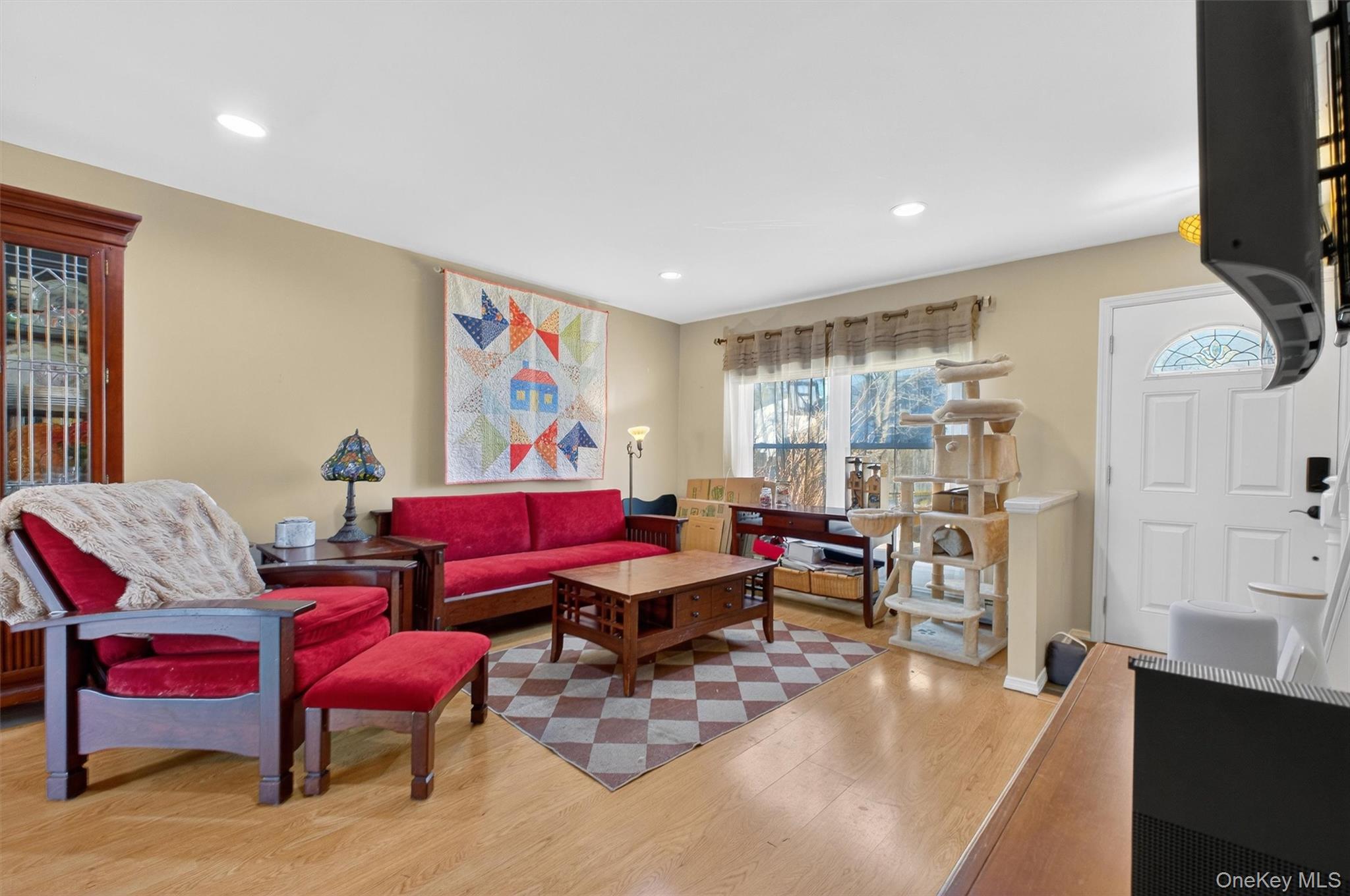 42 Larch Court Fishkill, NY 12524 - Photo 3 of 29 a living room with furniture and a flat screen tv