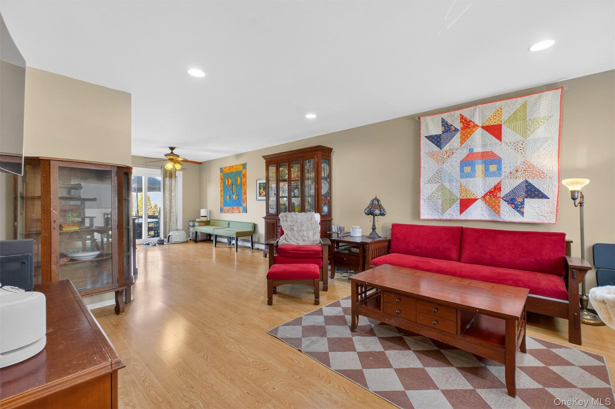 42 Larch Court Fishkill, NY 12524 - Photo 4 of 29 a living room with furniture and a painting on the wall
