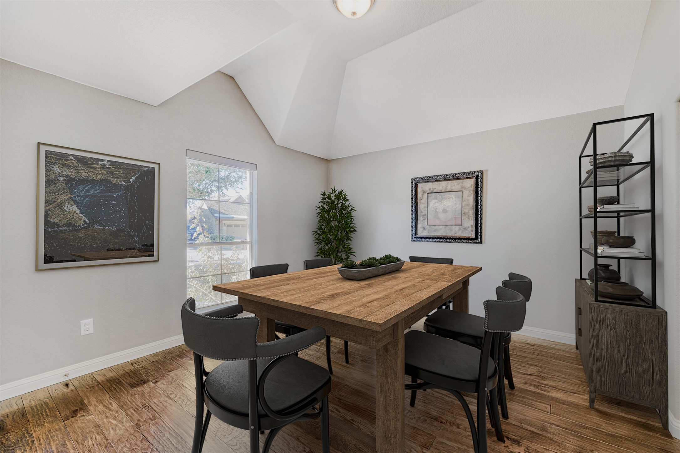 2431 Santa Barbara Loop Round Rock, TX 78665 - Photo 17 of 34 Dining space with wood finished floors and lofted ceiling