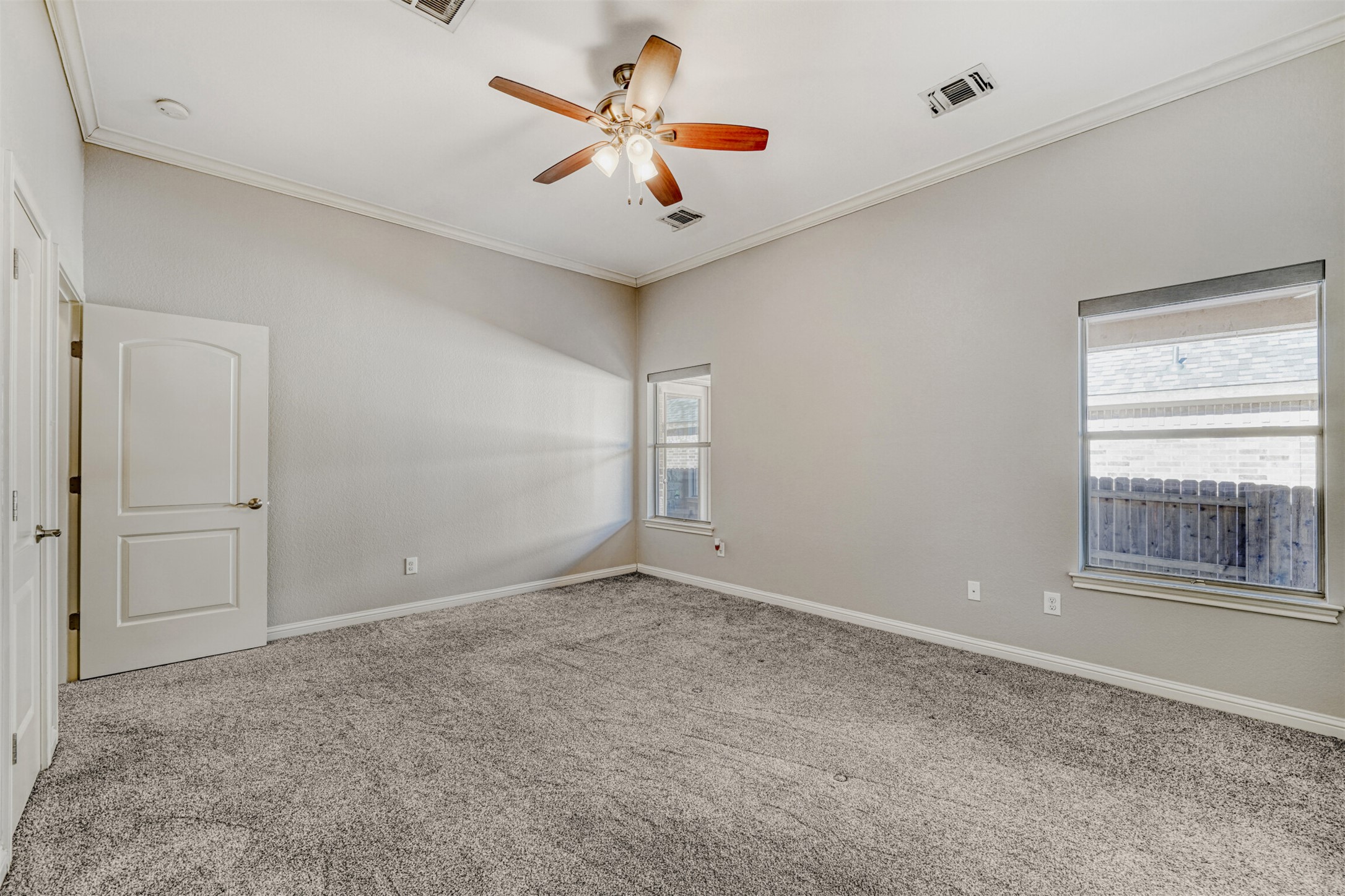 2431 Santa Barbara Loop Round Rock, TX 78665 - Photo 21 of 34 Unfurnished room with ornamental molding, carpet floors, and a ceiling fan