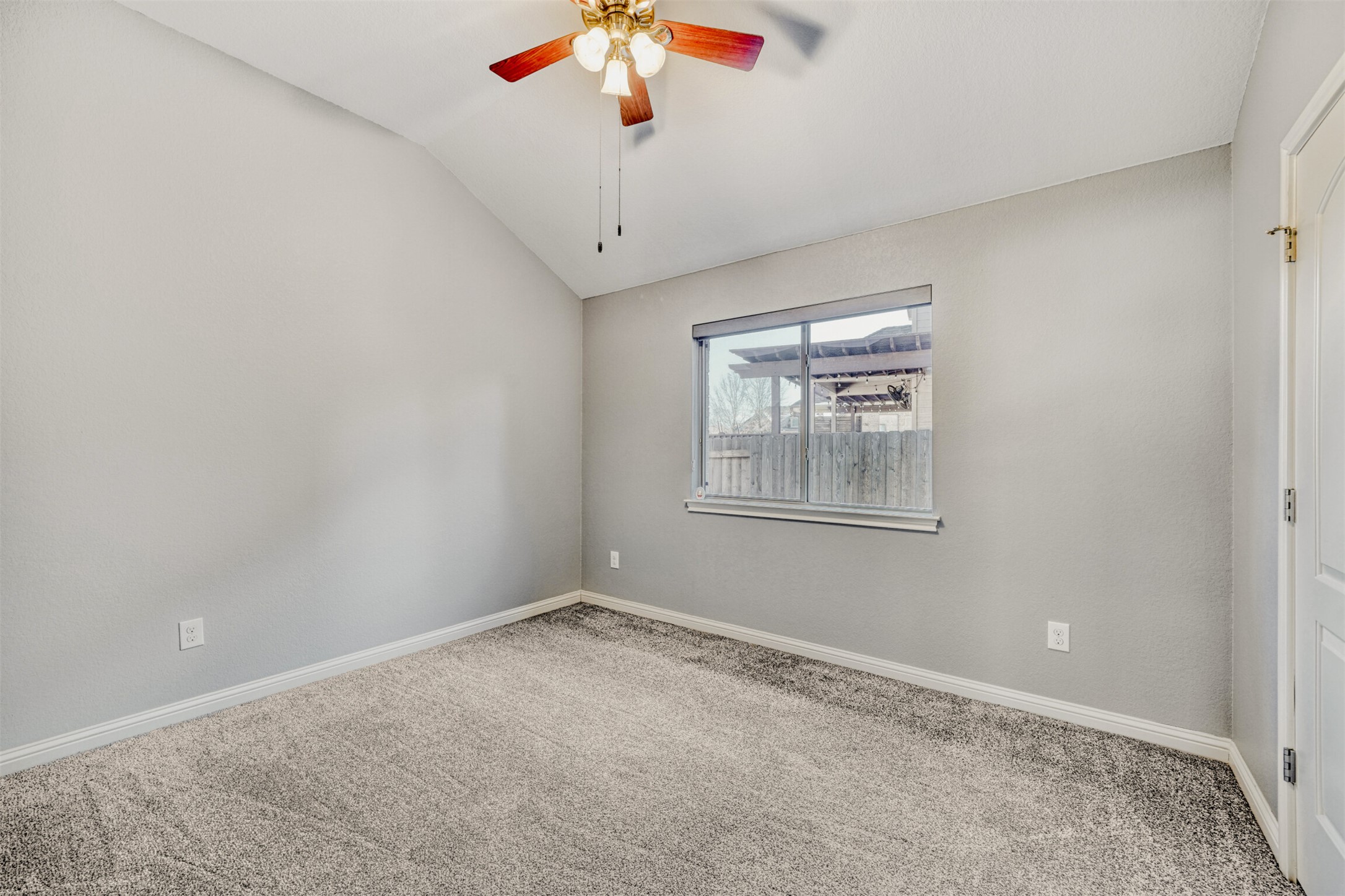 2431 Santa Barbara Loop Round Rock, TX 78665 - Photo 27 of 34 Carpeted empty room with lofted ceiling and ceiling fan