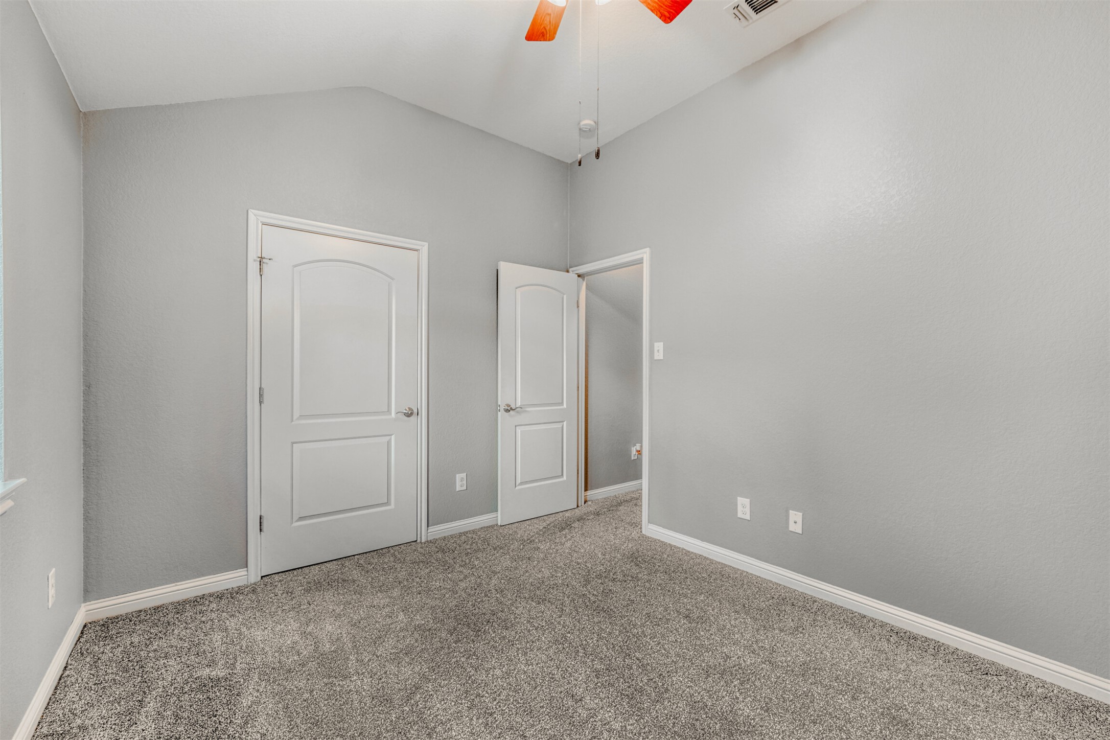 2431 Santa Barbara Loop Round Rock, TX 78665 - Photo 29 of 34 Unfurnished bedroom featuring vaulted ceiling, carpet flooring, and ceiling fan