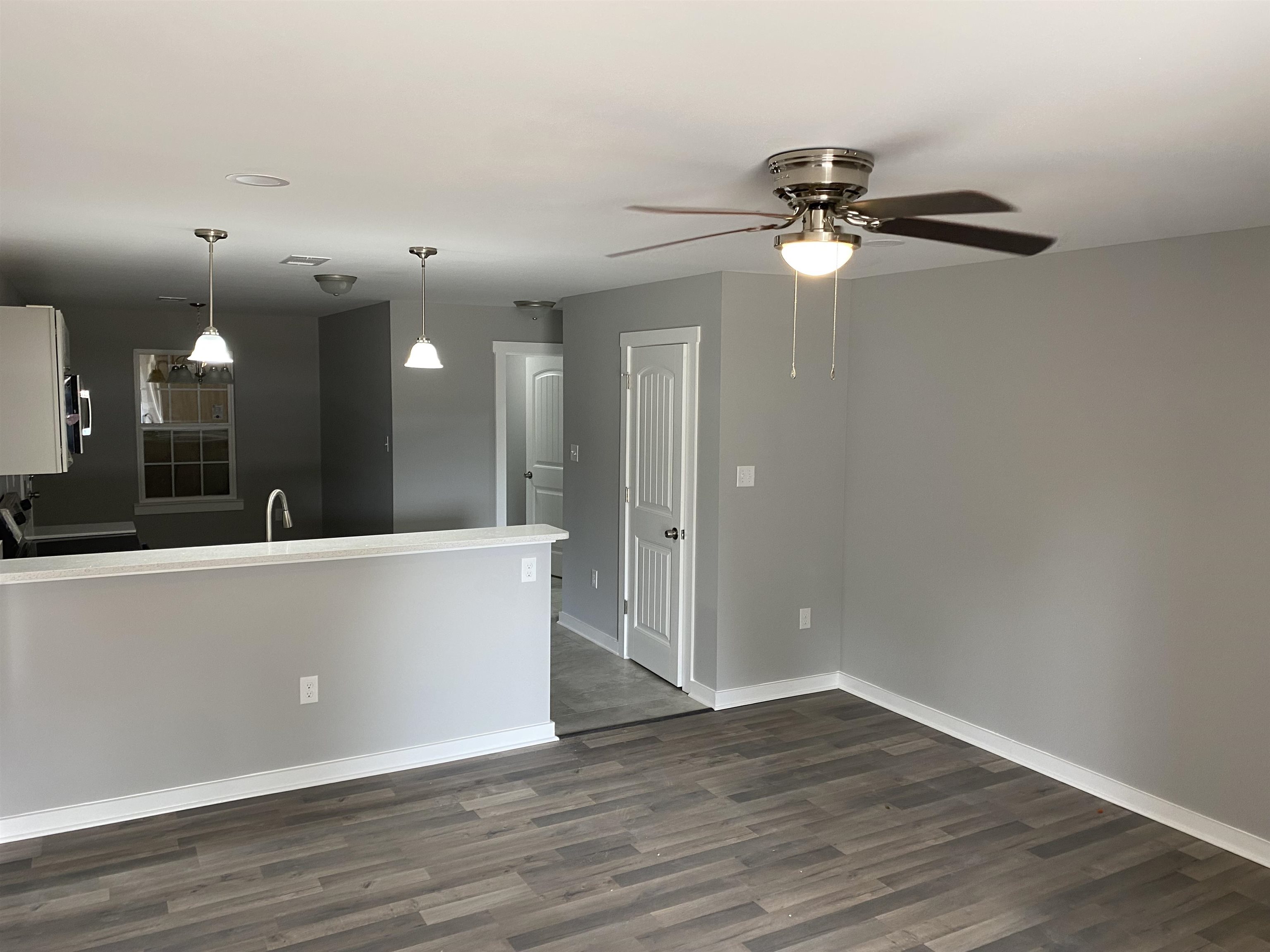 2352 Manchester Road Memphis, TN 38114 - Photo 2 of 36 a view of a living room with hardwood floor and a ceiling fan
