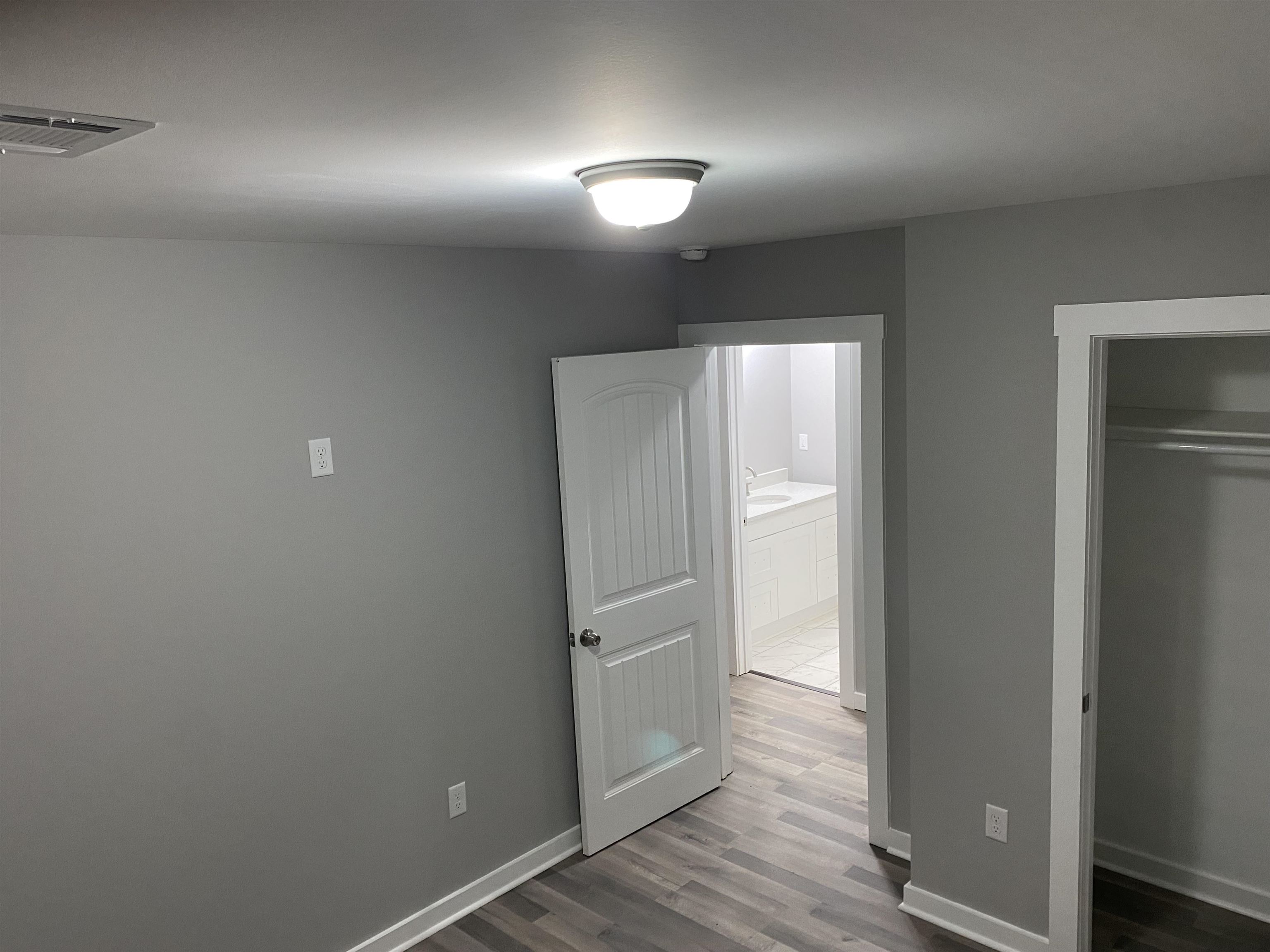 2352 Manchester Road Memphis, TN 38114 - Photo 32 of 36 a view of an empty room and wooden floor