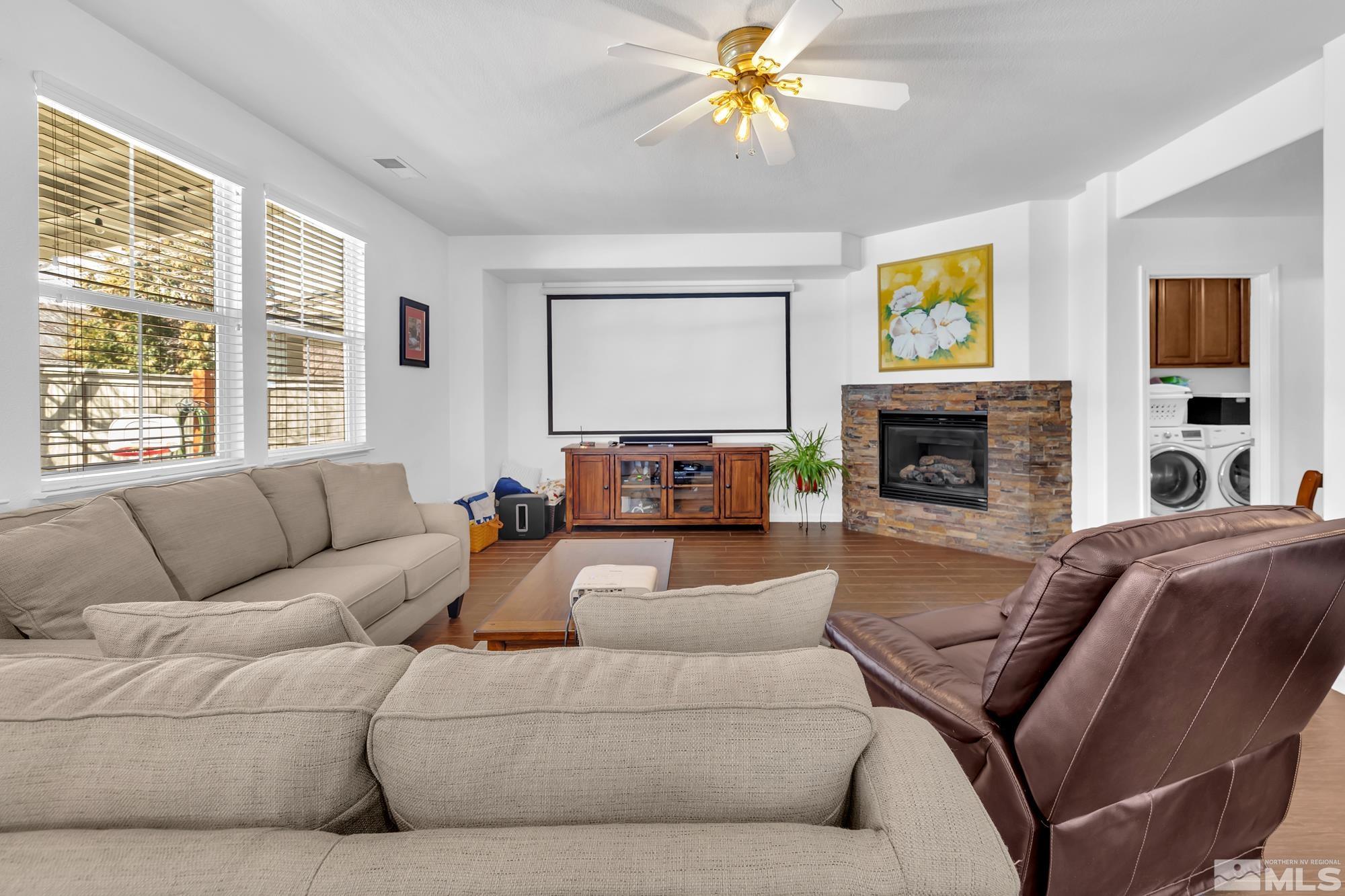 596 Needles Court Reno, NV 89521 - Photo 13 of 40 a living room with a couch and a fireplace