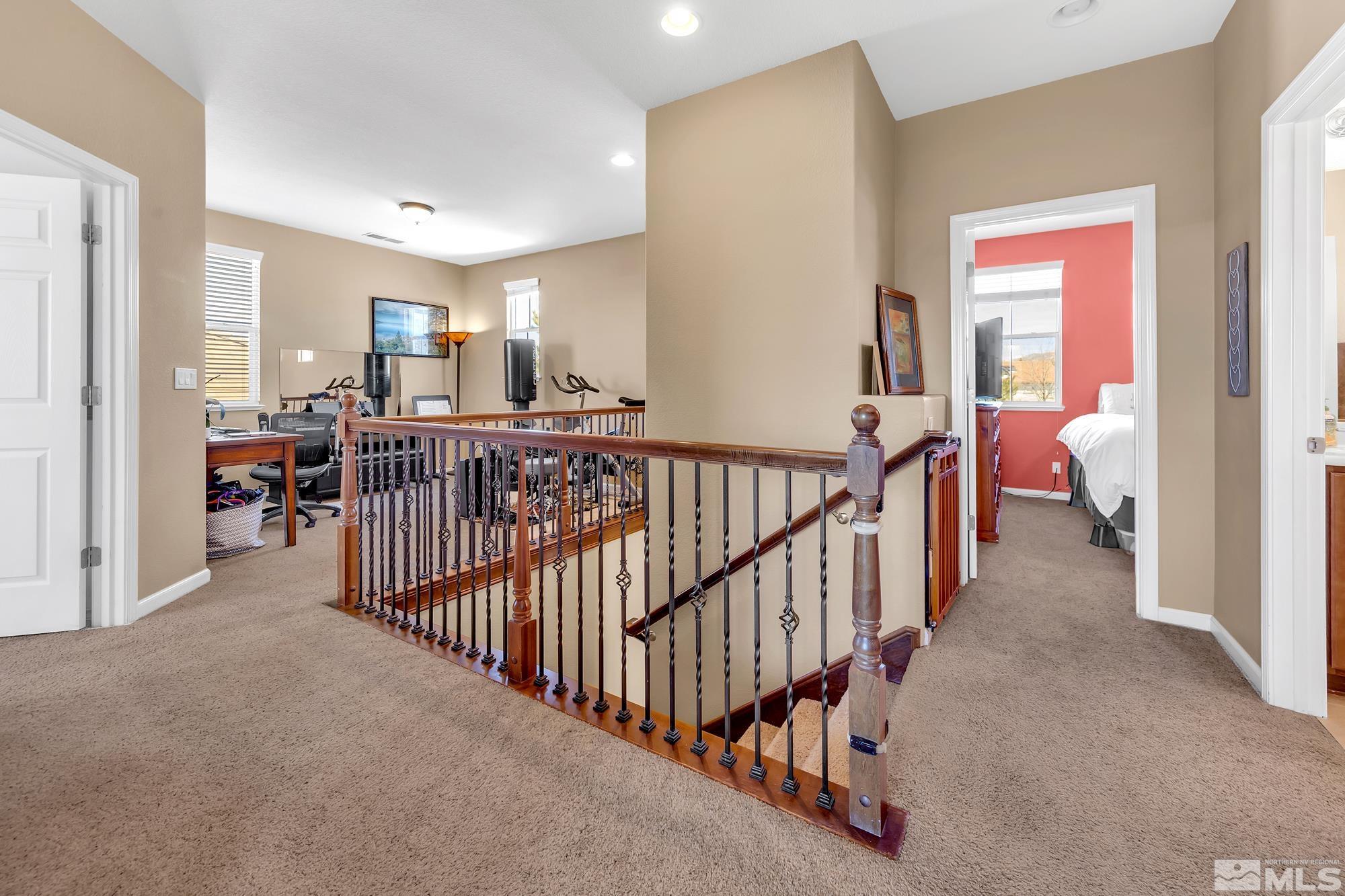596 Needles Court Reno, NV 89521 - Photo 20 of 40 a view of a hallway with bedroom and balcony