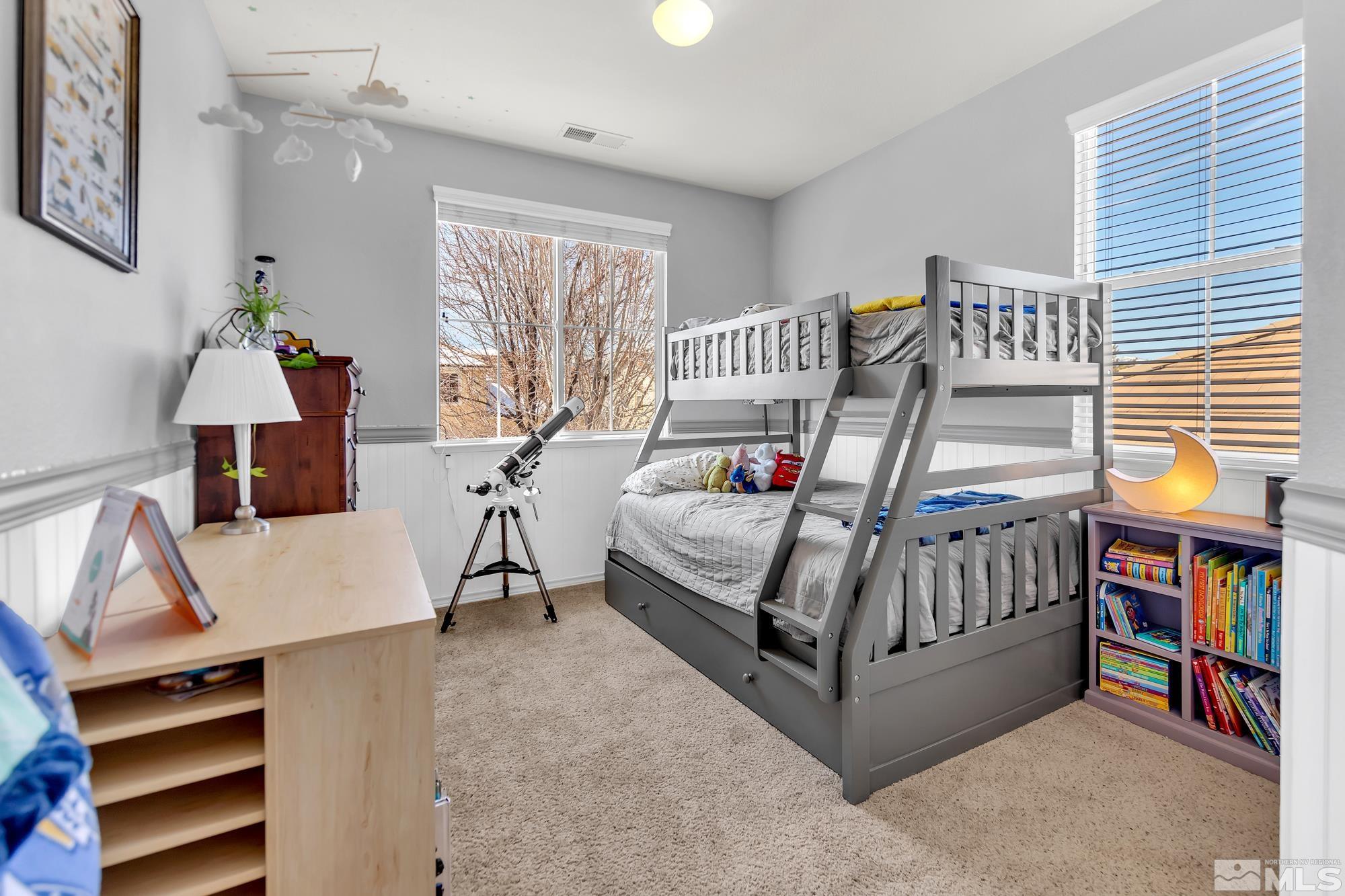 596 Needles Court Reno, NV 89521 - Photo 29 of 40 a bedroom with furniture and a window