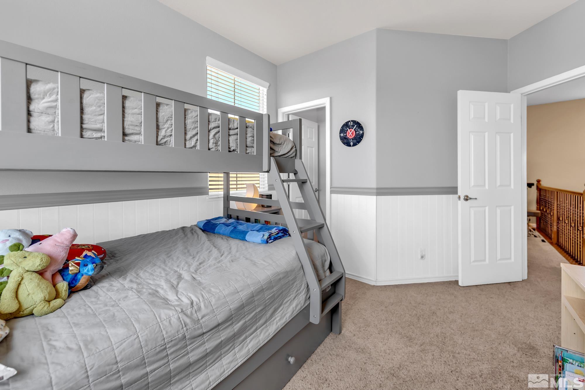 596 Needles Court Reno, NV 89521 - Photo 30 of 40 a bedroom with a bed and a window