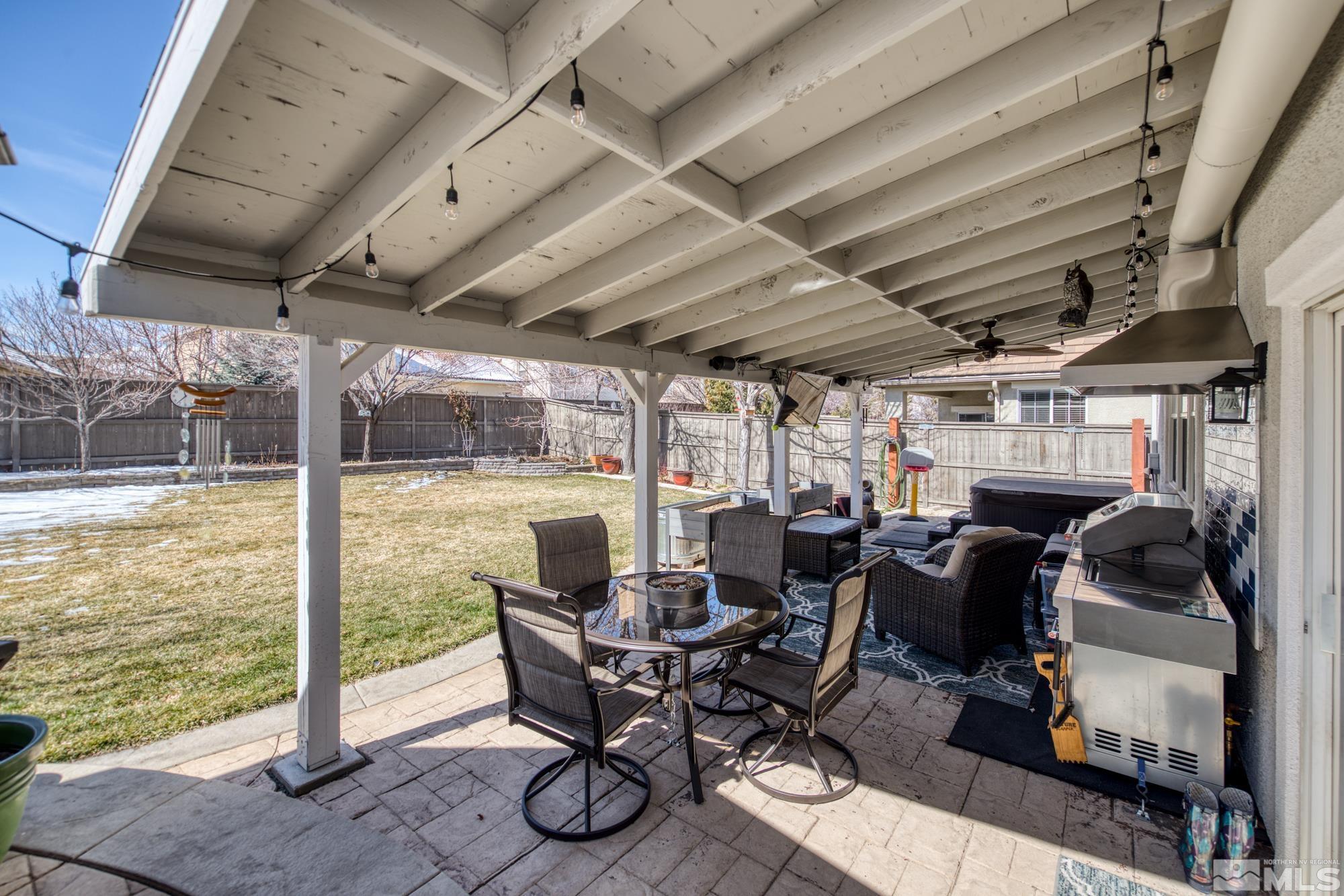 596 Needles Court Reno, NV 89521 - Photo 32 of 40 a view of a patio with table and chairs