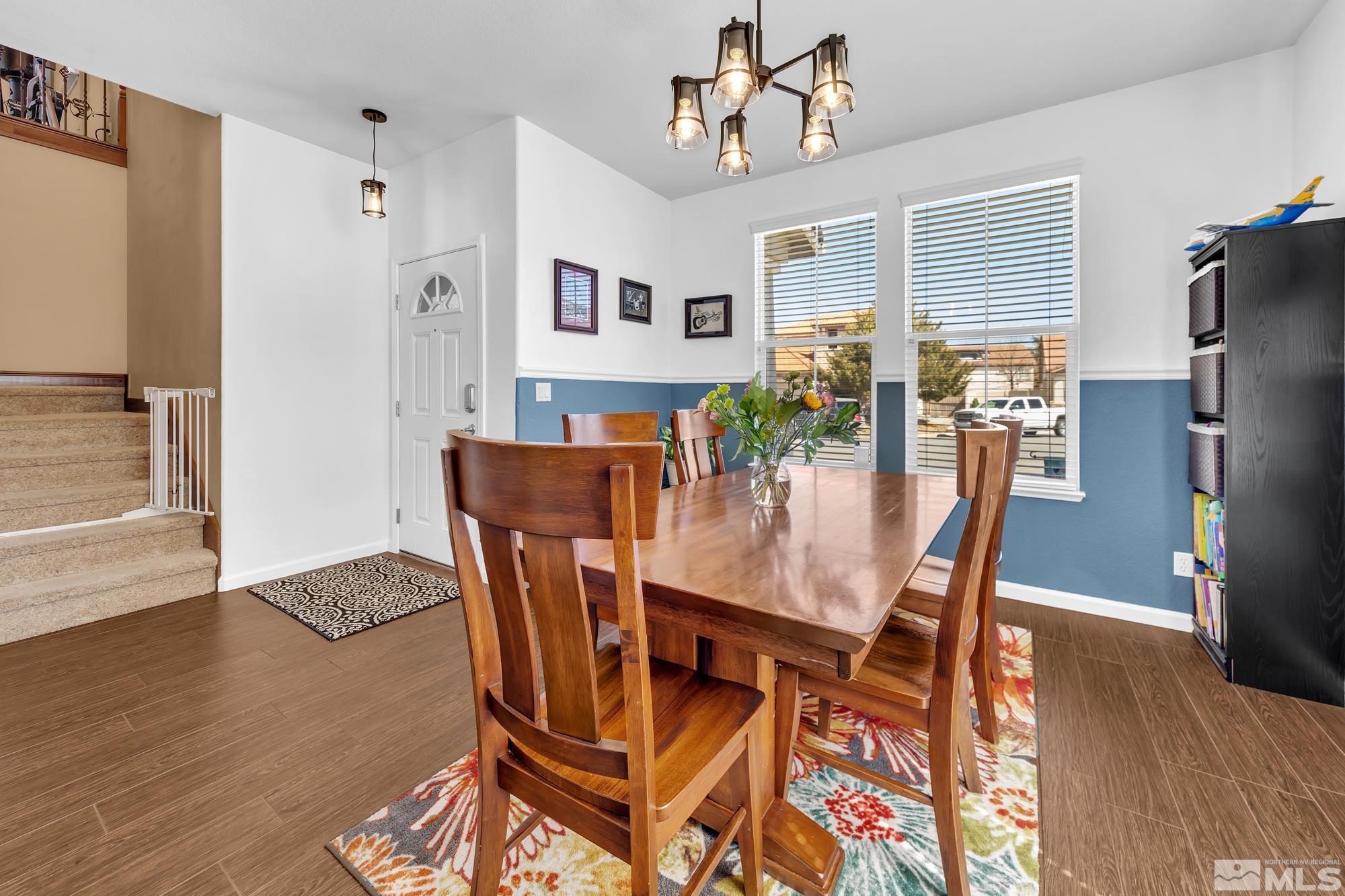 596 Needles Court Reno, NV 89521 - Photo 5 of 40 a view of a dining room with furniture and wooden floor
