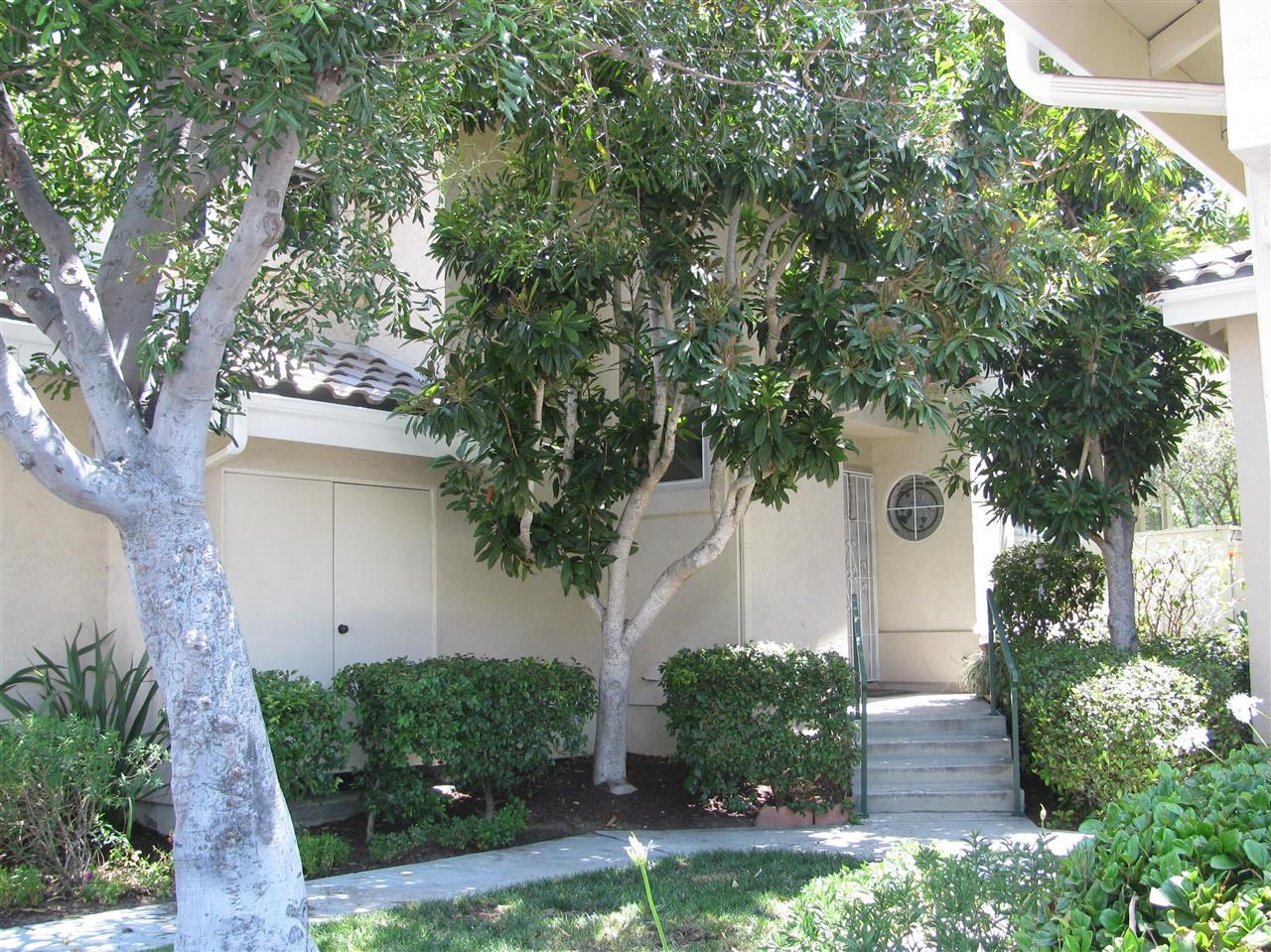 1834 Key Largo Road Vista, CA 92081 - Photo 2 of 25 Waltz through the front doors of this end unit townhome nestled behind the shade of a delightful tree!