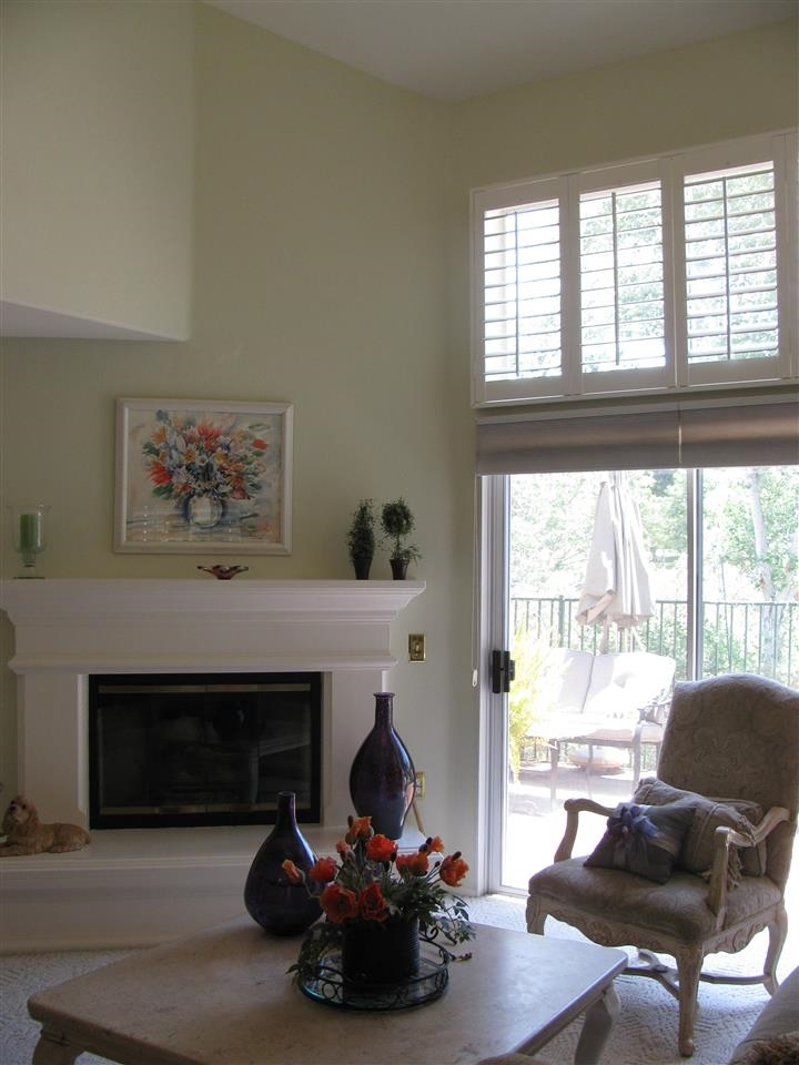 1834 Key Largo Road Vista, CA 92081 - Photo 4 of 25 Cathedral ceilings in the living room and dining room offer abundance of natural light! Fireplace adds ambiance and through those sliding glass doors is one amazing patio - superb for entertaining and relaxing!