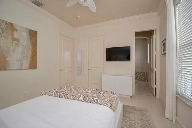 a work room with furniture and a flat screen tv