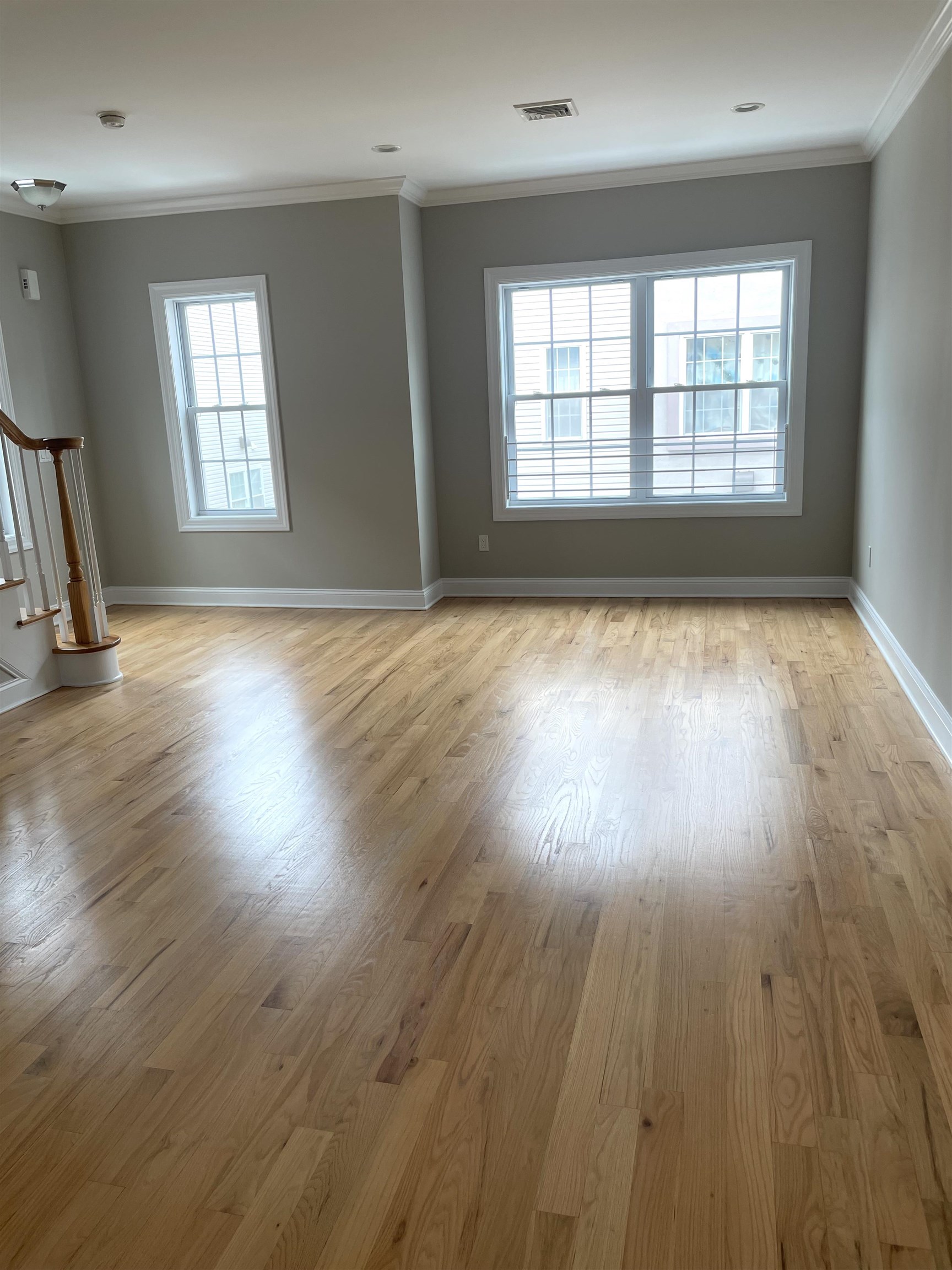 734 County Avenue, Unit A1 Secaucus, NJ 07094 - Photo 2 of 19 an empty room with wooden floor and windows
