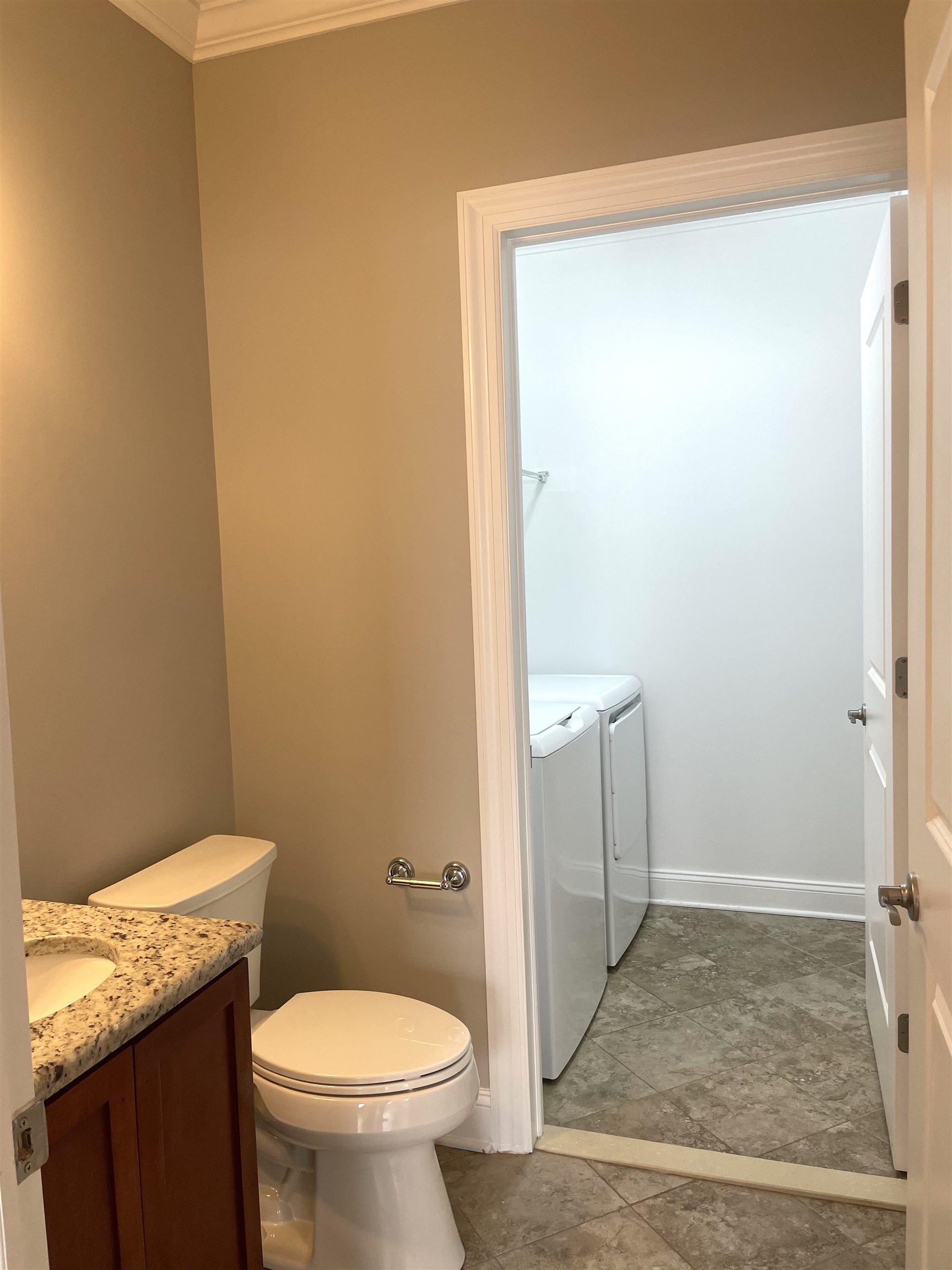 734 County Avenue, Unit A1 Secaucus, NJ 07094 - Photo 3 of 19 a bathroom with a granite countertop toilet and a sink