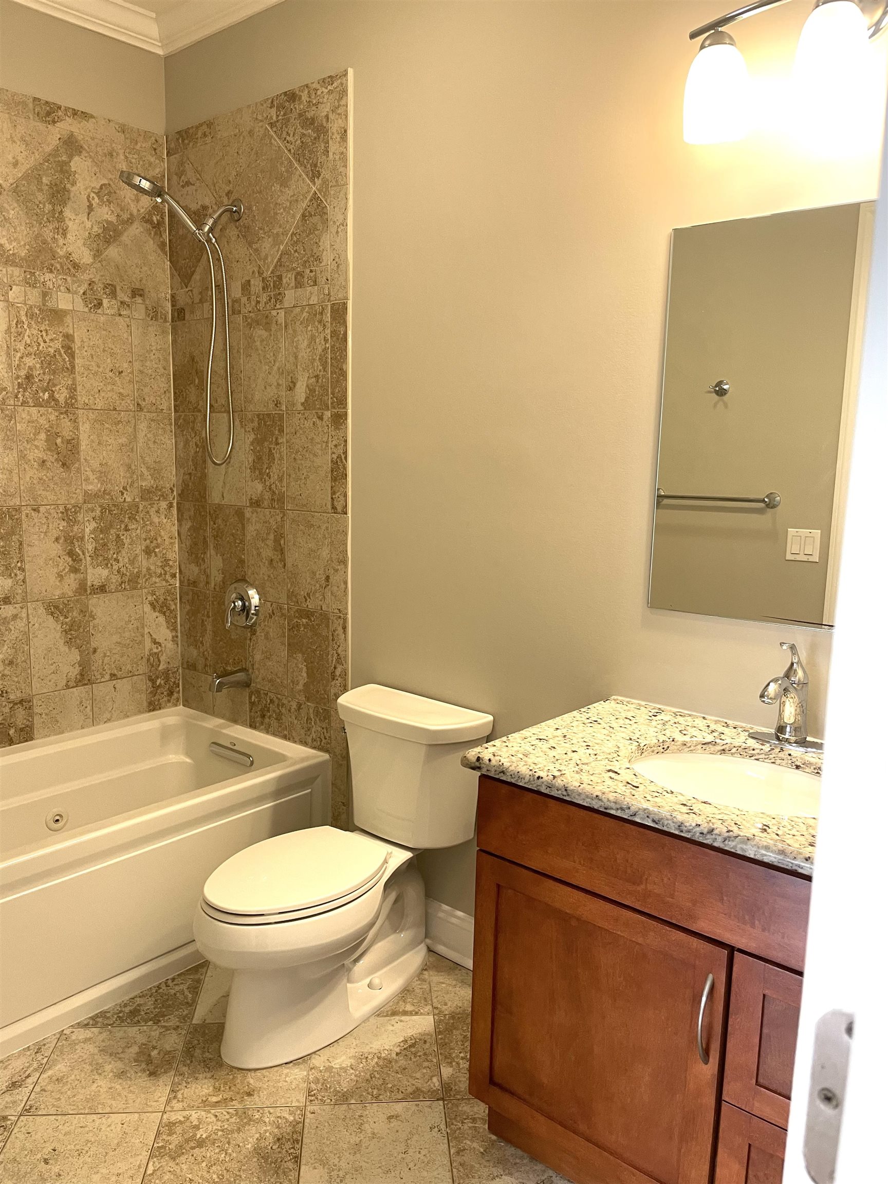 734 County Avenue, Unit A1 Secaucus, NJ 07094 - Photo 10 of 19 a bathroom with a granite countertop sink mirror toilet and bathtub