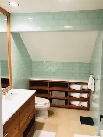 a bedroom with a balcony a bed and a couch