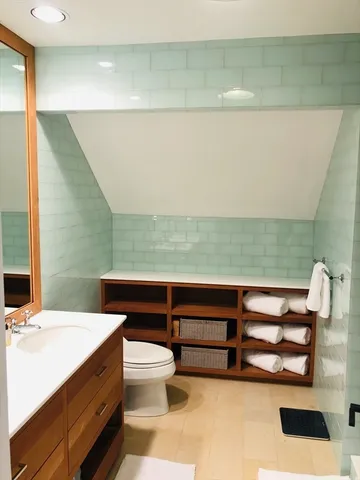 a bedroom with a balcony a bed and a couch