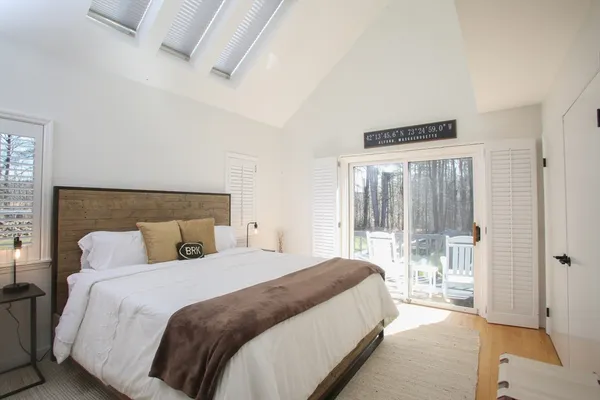 a bedroom with a bed and window