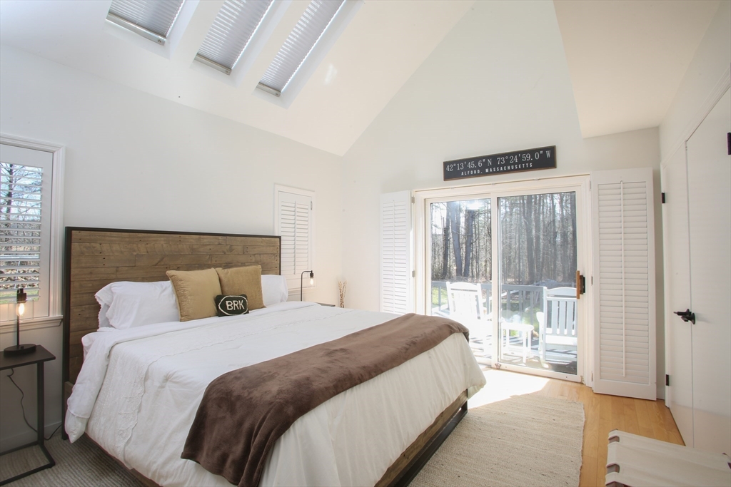 23 Cross Road Alford, MA 01230 - Photo 18 of 37 a bedroom with a balcony a bed and a couch