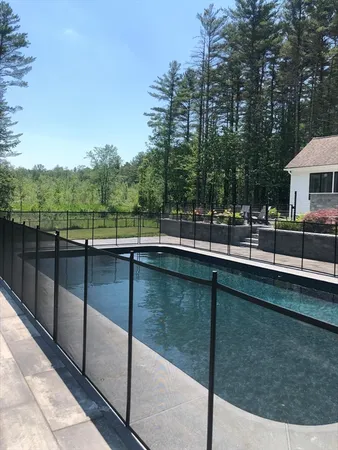 a view of a swimming pool with a patio