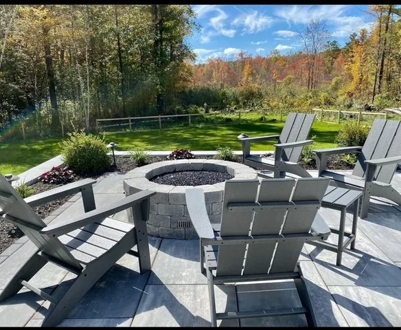 a view of swimming pool with chairs