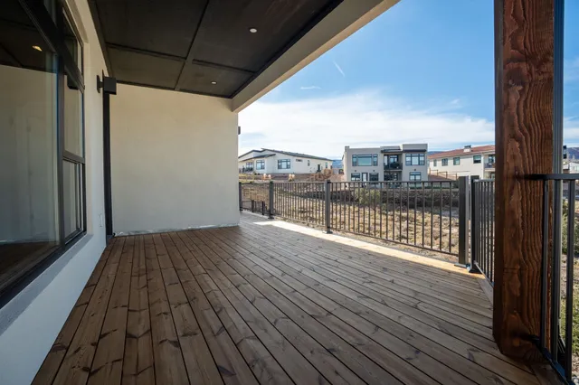 a view of a balcony with wooden floor