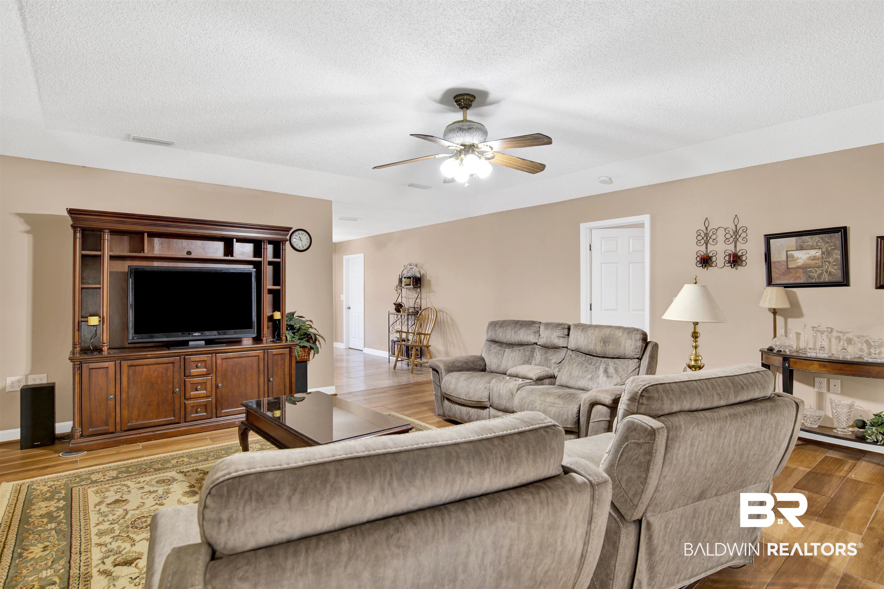 36434 Alexandria Trail Stapleton, AL 36578 - Photo 6 of 27 Living area featuring light wood-style floors, a ceiling fan, and a textured ceiling