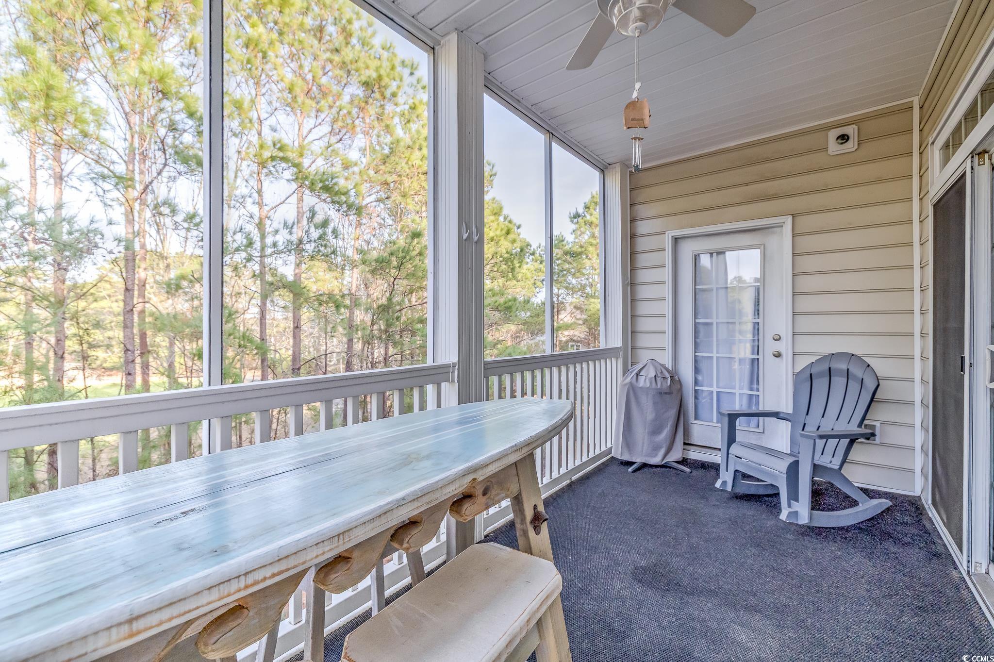 719 Shearwater Court, Unit 303 Murrells Inlet, SC 29576 - Photo 15 of 20 Sunroom / solarium with outdoor dining area, ceiling fan, and a balcony