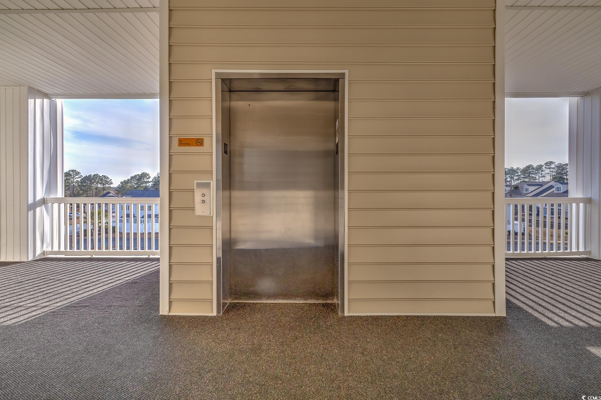 719 Shearwater Court, Unit 303 Murrells Inlet, SC 29576 - Photo 6 of 20 Exterior space with elevator