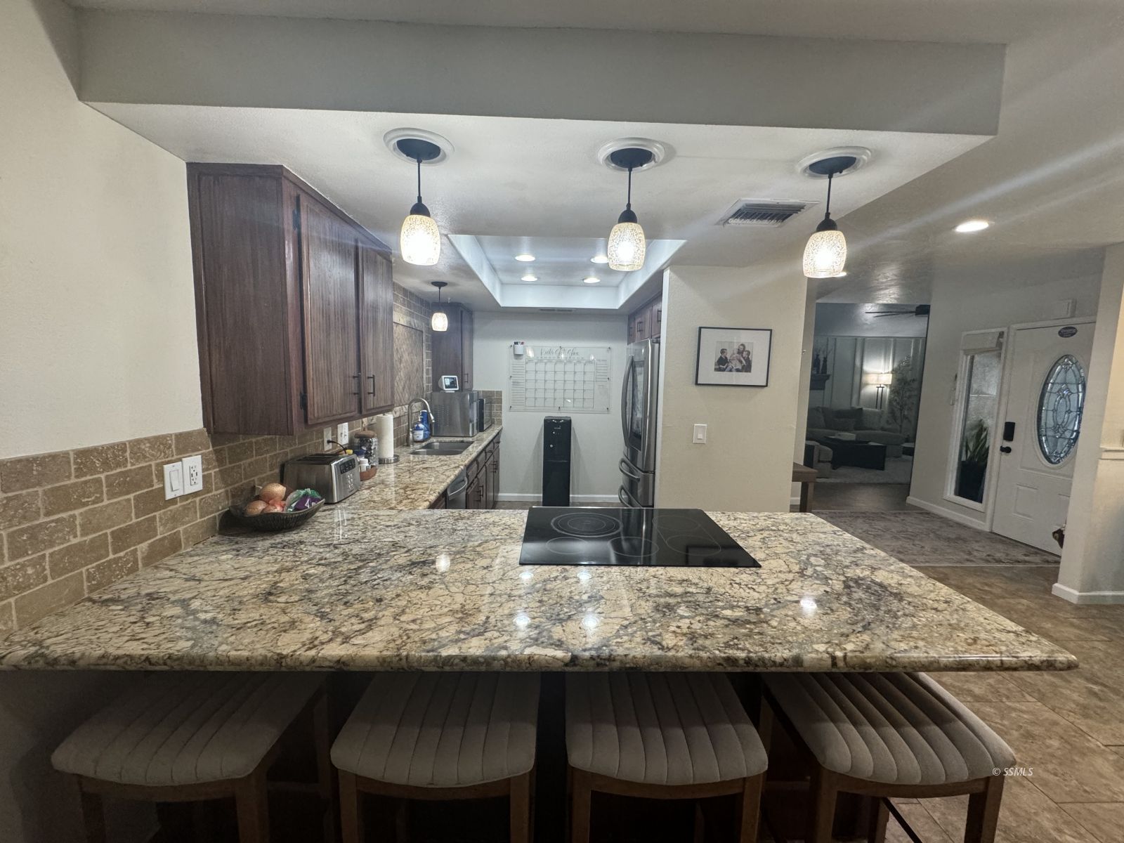 1024 Las Cruces Avenue Ridgecrest, CA 93555 - Photo 11 of 37 a kitchen with a table and chairs in it