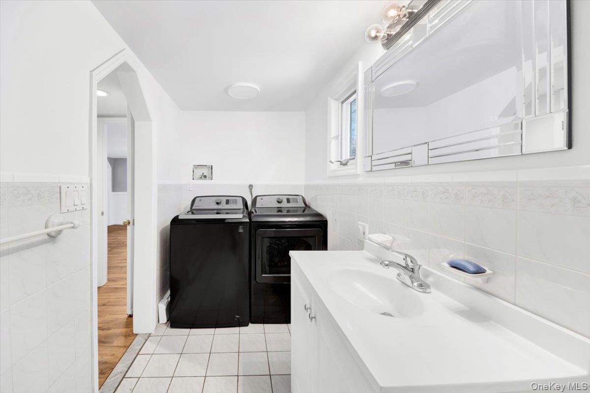 3843 Perry Street Jefferson Valley, NY 10535 - Photo 12 of 36 a bathroom with a sink and a mirror