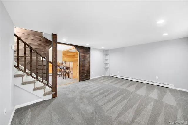 a view of an empty room with stairs