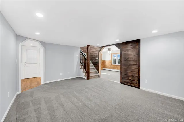 a view of an empty room with a fireplace