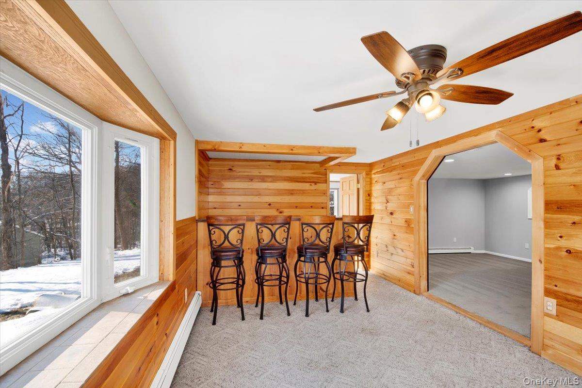 3843 Perry Street Jefferson Valley, NY 10535 - Photo 19 of 36 a dining room with furniture and a floor to ceiling window